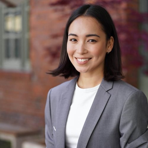 smiling-young-asian-woman-professional-manager-wea-2025-02-11-16-20-21-utc-e1751518473164.jpg